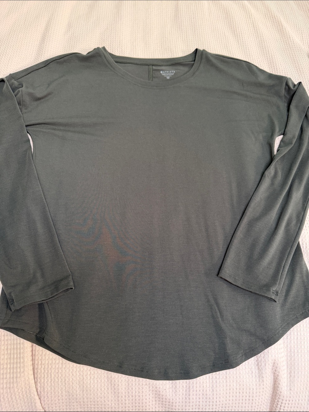 Athleta sz XXS (gen fit) olive long sleeve top rounded hem vert back seam
